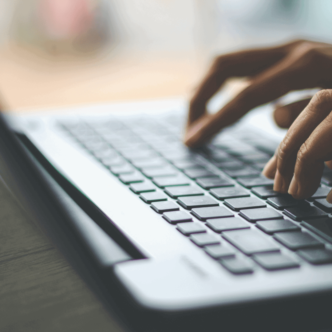 Hand typing on a keyboard
